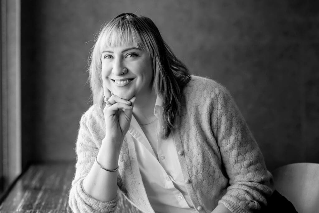 Professional write posing for a camera with a smile in SF bay area.