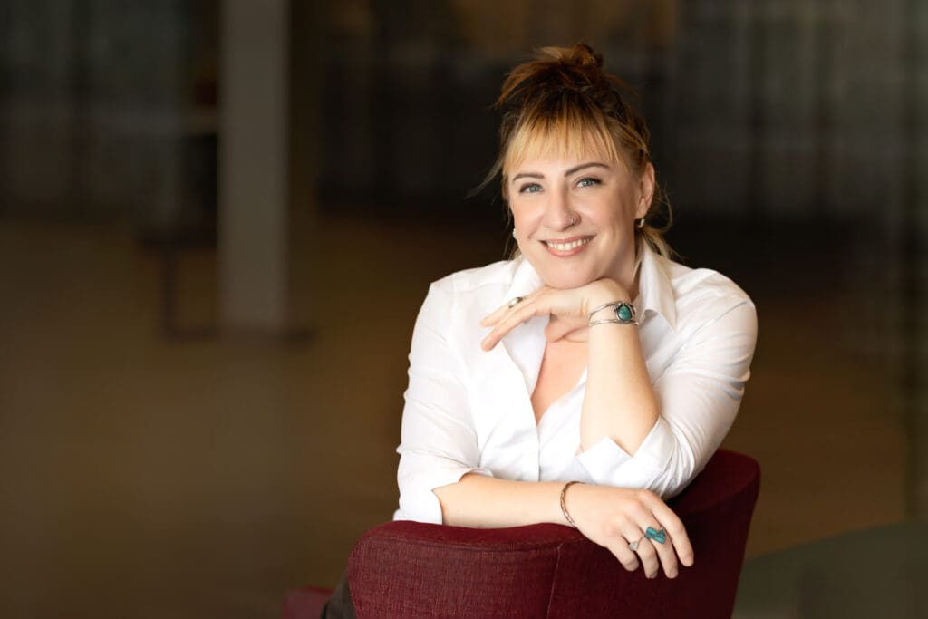Professional woman smiling confidently during a personal branding headshot session in San Francisco Bay Area.