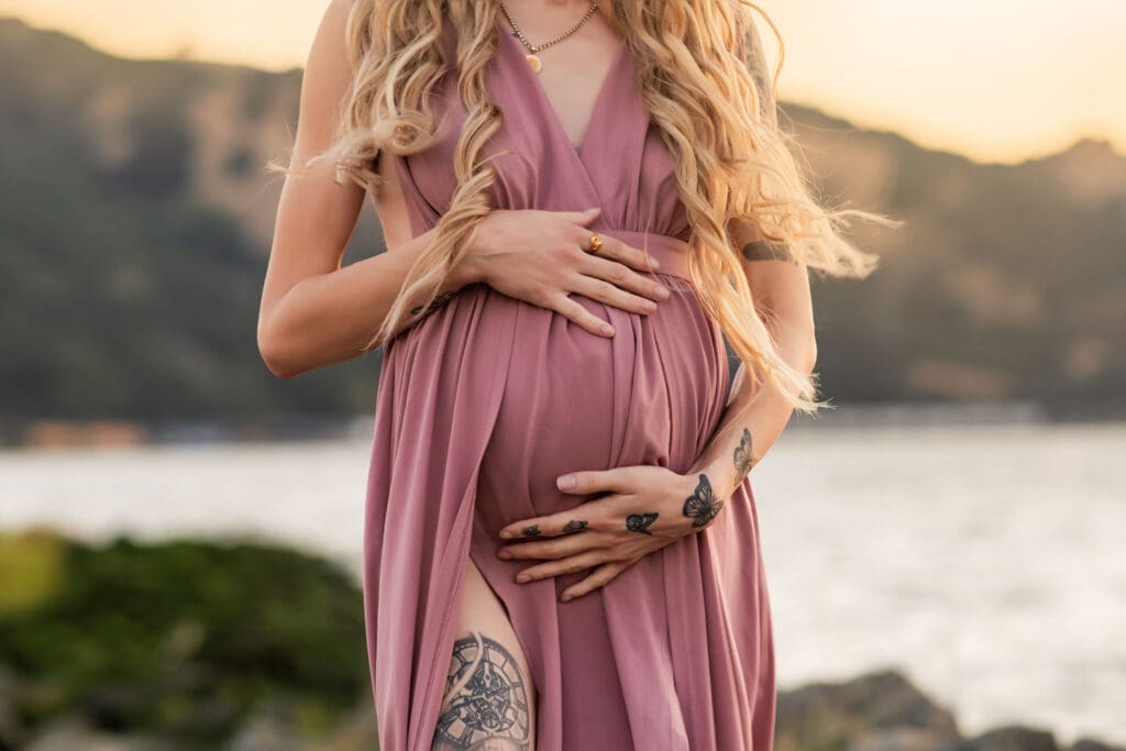 Expecting mother during Outdoor Maternity Photography session near a shoreline