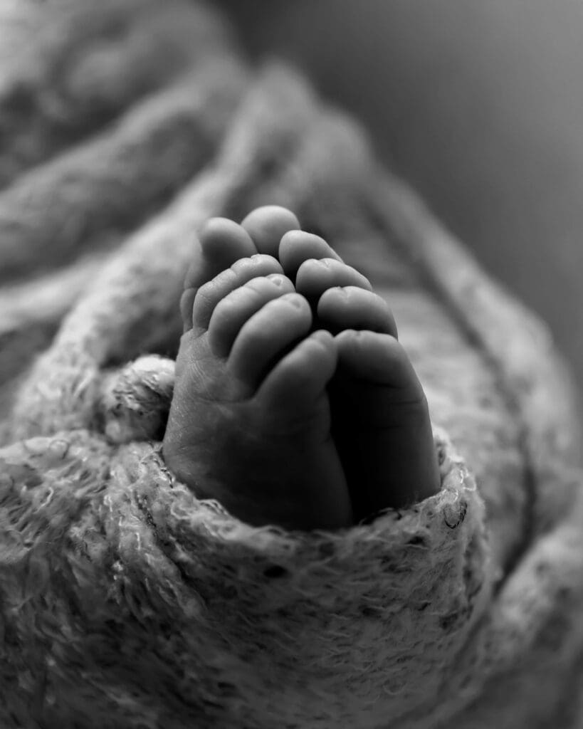Sleeping newborns macro image of toes